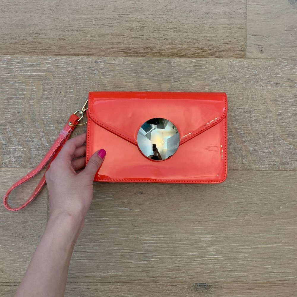 NWOT Bebe Bright Orange Wristlet With Gold Circle